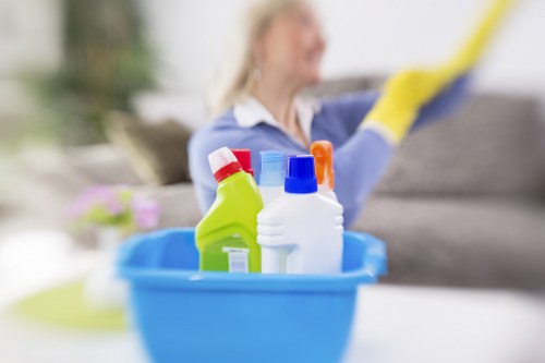Technician performing carpet cleaning in Acton cleaner treatment on a living room floor